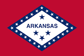 Okay, not quite the Stars and Bars, but in 1987, Bill Clinton signed a statement by the General Assembly of Arkansas, wherein he explained that "the blue star above the word 'ARKANSAS' is to commemorate the Confederate States of America" (Act 116 of the 1987 Regular Session). You might know Bill from the fact that his wife is currently the Democratic front runner. This is all a trick! Wake up, sheeple! 